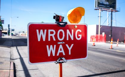 red Wrong Way signage on road